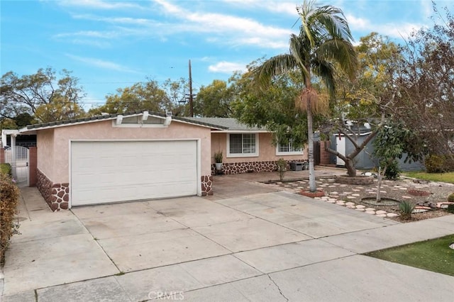 ranch-style home featuring stucco siding, concrete driveway, and a garage