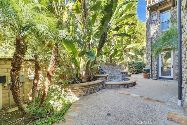 view of yard featuring a patio and fence