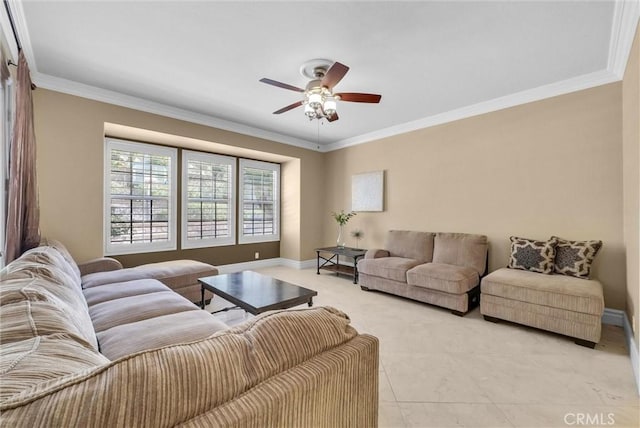 living area featuring a ceiling fan, baseboards, and ornamental molding