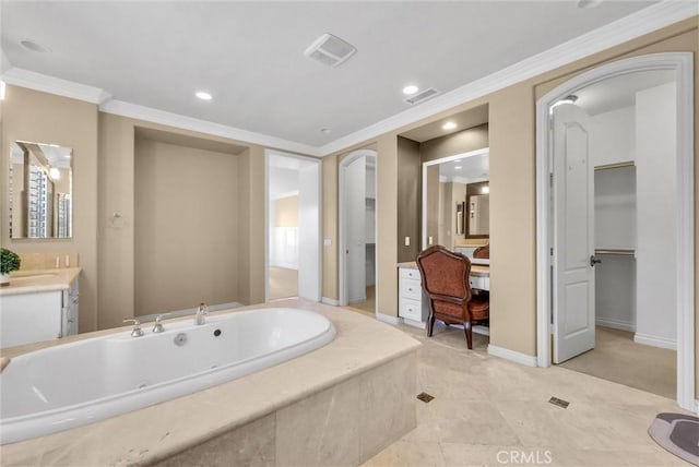 full bathroom featuring visible vents, a jetted tub, ornamental molding, and vanity