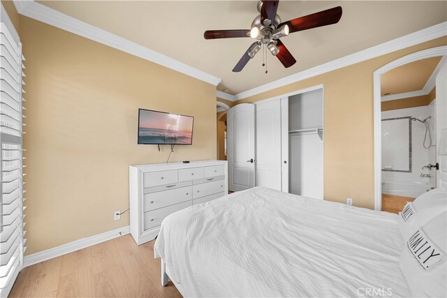 37 Shepard, Irvine, CA 92620 - bedroom with arched walkways, baseboards, a closet, ceiling fan, and ornamental molding