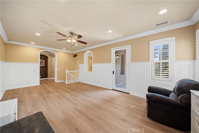 37 Shepard, Irvine, CA 92620 - living room with a wainscoted wall, arched walkways, visible vents, ceiling fan, and a decorative wall