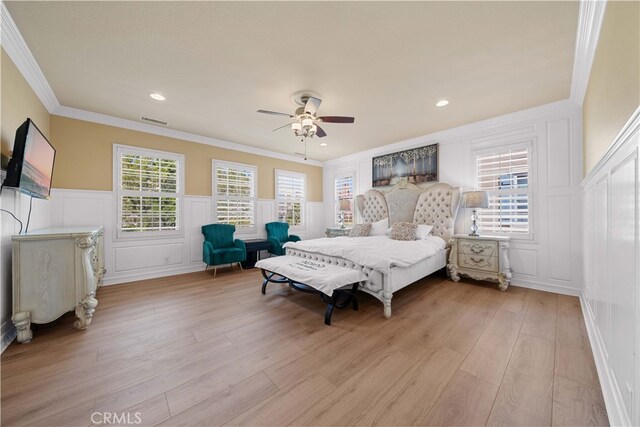 37 Shepard, Irvine, CA 92620 - bedroom with a decorative wall, ornamental molding, multiple windows, and light wood finished floors