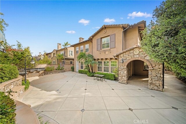 37 Shepard, Irvine, CA 92620 - rear view of property with a patio area, a tile roof, a fireplace, and stucco siding