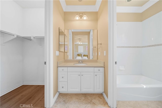 37 Shepard, Irvine, CA 92620 - full bathroom with baseboards, a ceiling fan, ornamental molding, vanity, and a walk in closet