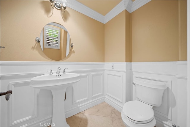 37 Shepard, Irvine, CA 92620 - half bathroom with toilet, a decorative wall, crown molding, and a wainscoted wall