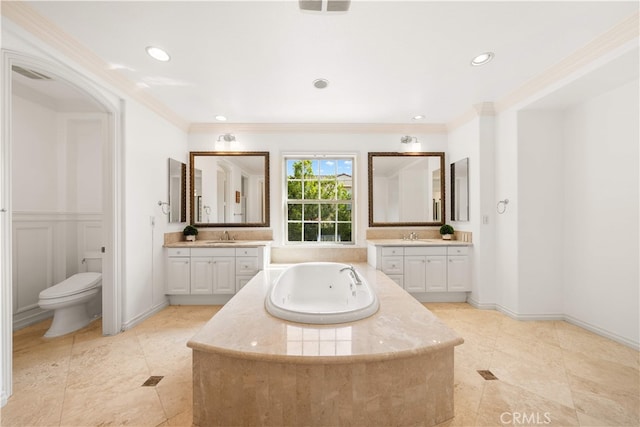 37 Shepard, Irvine, CA 92620 - bathroom featuring a whirlpool tub, two vanities, crown molding, tile patterned floors, and recessed lighting