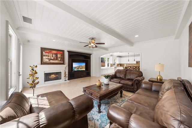 37 Shepard, Irvine, CA 92620 - living room featuring a glass covered fireplace, beamed ceiling, arched walkways, and a ceiling fan