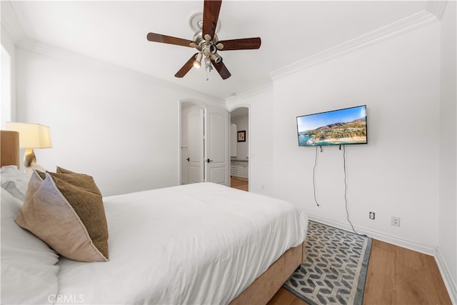 37 Shepard, Irvine, CA 92620 - bedroom with arched walkways, wood finished floors, crown molding, and a ceiling fan
