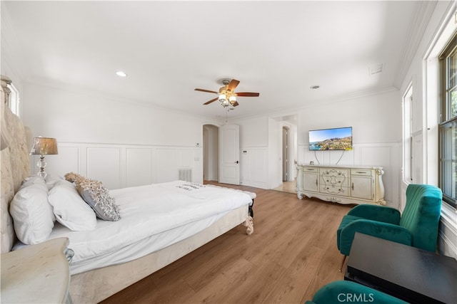 37 Shepard, Irvine, CA 92620 - bedroom featuring a decorative wall, crown molding, wood finished floors, wainscoting, and a ceiling fan
