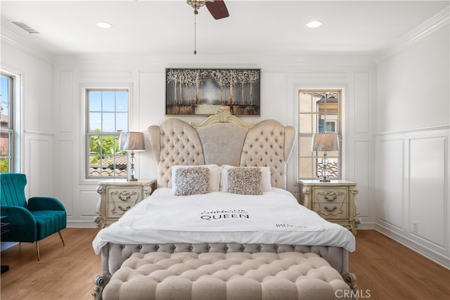 37 Shepard, Irvine, CA 92620 - bedroom with a decorative wall, light wood-type flooring, ornamental molding, a wainscoted wall, and a ceiling fan