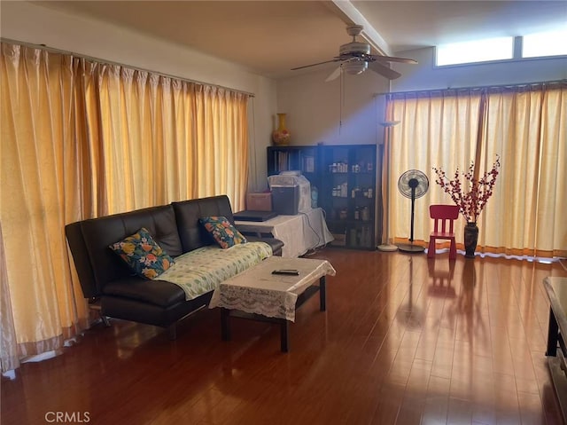 living room featuring ceiling fan and wood finished floors