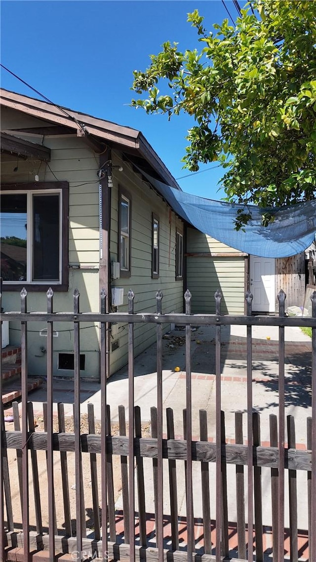 view of property exterior featuring fence