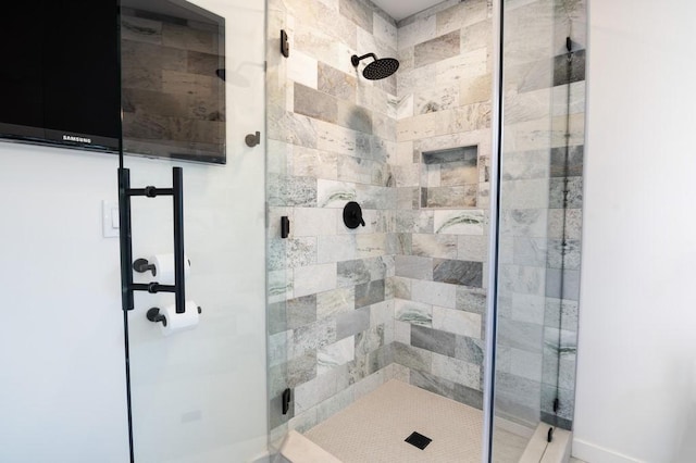 bathroom with a shower stall