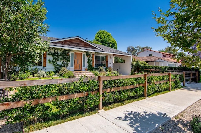 single story home featuring a fenced front yard