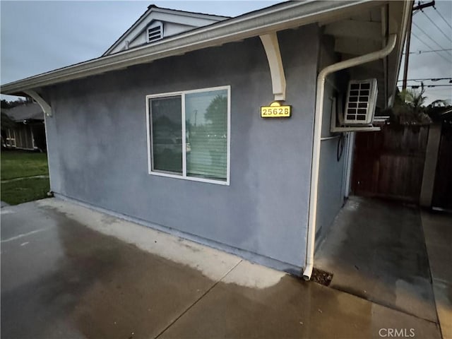 view of side of home featuring stucco siding