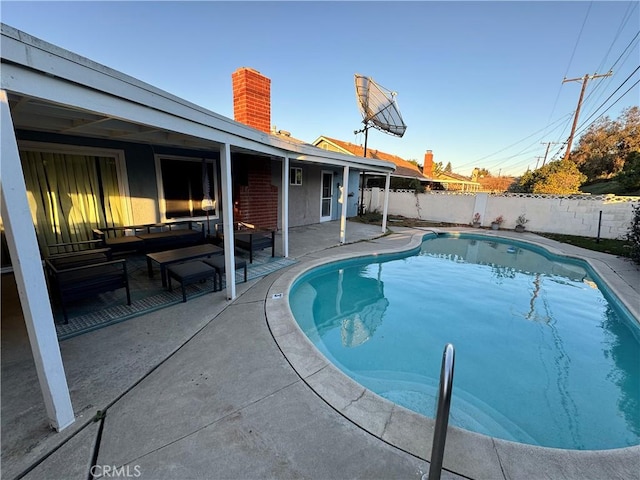 view of pool featuring a patio area, a fenced backyard, outdoor lounge area, and a fenced in pool