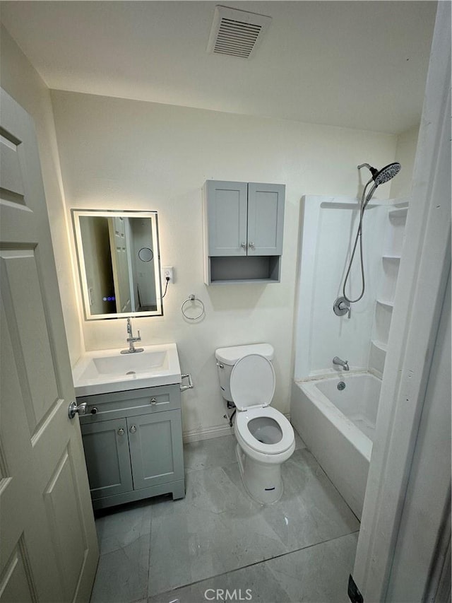 full bathroom with shower / washtub combination, marble finish floor, visible vents, toilet, and vanity