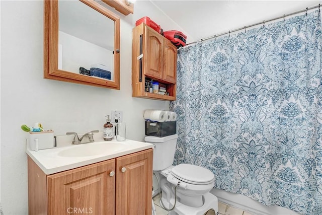 full bath featuring toilet, vanity, and curtained shower