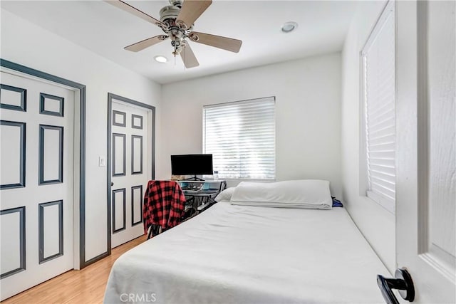 bedroom featuring ceiling fan and light wood-style floors