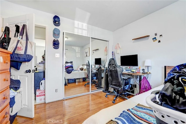 bedroom with a closet and wood finished floors