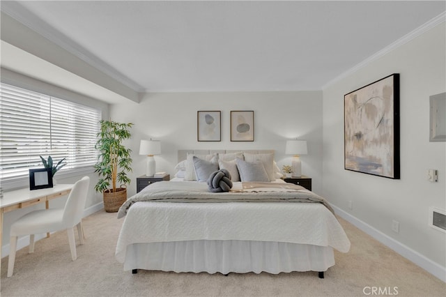 carpeted bedroom featuring crown molding and baseboards