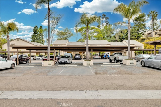 view of partially covered parking lot