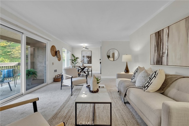 living area featuring light carpet, crown molding, and baseboards