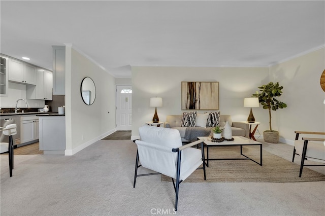 living area with recessed lighting, baseboards, crown molding, and light colored carpet