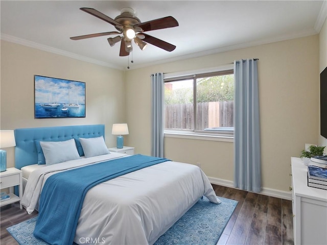 bedroom featuring ornamental molding, ceiling fan, baseboards, and wood finished floors