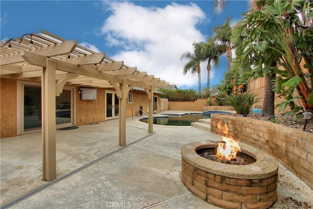 view of patio / terrace featuring a fenced backyard, a fire pit, a pergola, and a fenced in pool