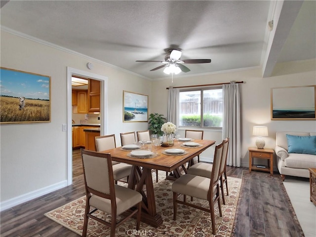 dining area with ornamental molding, ceiling fan, baseboards, and wood finished floors