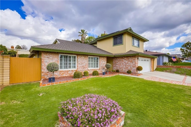 view of front of property featuring brick siding, a front yard, fence, a garage, and driveway