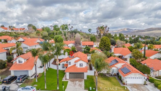 aerial view with a mountain view and a residential view