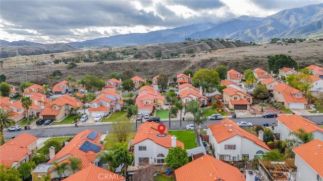 bird's eye view with a residential view and a mountain view