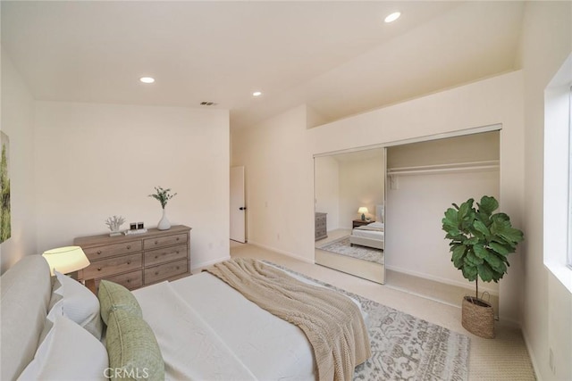 carpeted bedroom featuring recessed lighting, a closet, visible vents, vaulted ceiling, and baseboards