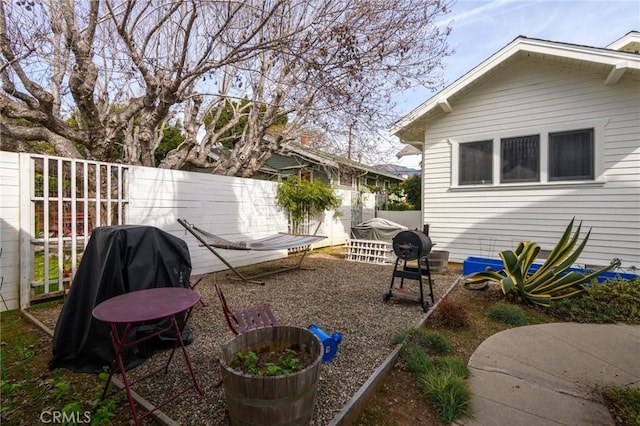 view of yard featuring a patio and fence