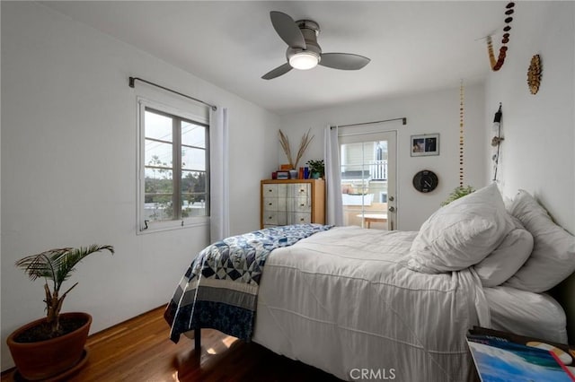 bedroom featuring a ceiling fan and wood finished floors