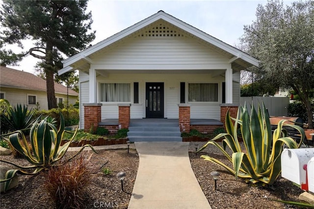 view of front of property with a porch and brick siding