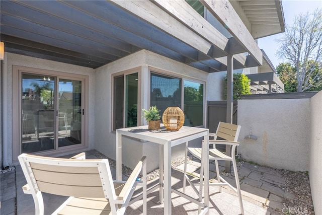 view of patio featuring fence