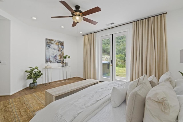 bedroom with access to outside, visible vents, wood finished floors, and recessed lighting