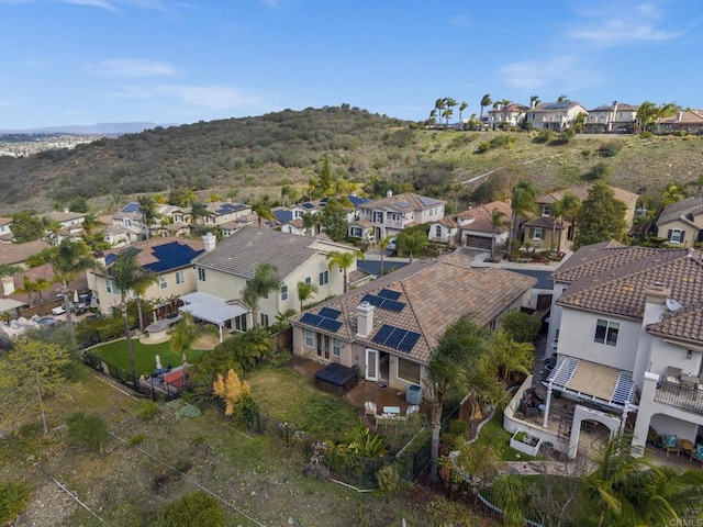 birds eye view of property with a residential view