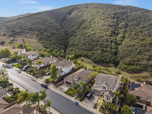 birds eye view of property with a mountain view and a residential view