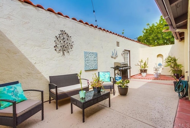 view of patio / terrace featuring outdoor lounge area and grilling area