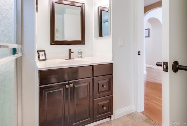 bathroom featuring vanity and baseboards