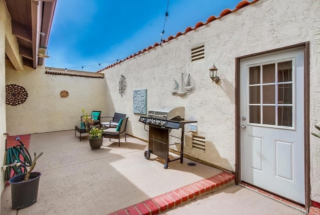 view of patio / terrace featuring a grill