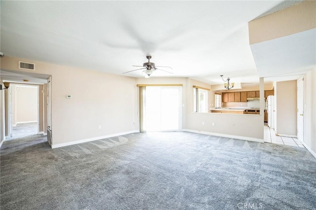 unfurnished living room with light carpet, ceiling fan, visible vents, and baseboards