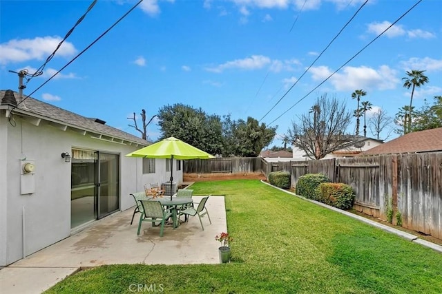 view of yard featuring a patio and a fenced backyard