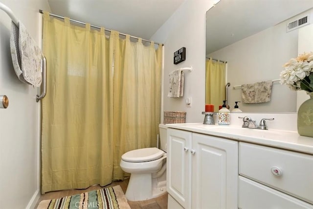 bathroom with vanity, toilet, a shower with curtain, and visible vents