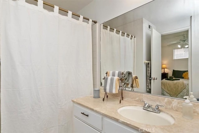 ensuite bathroom featuring visible vents, connected bathroom, vanity, and ceiling fan